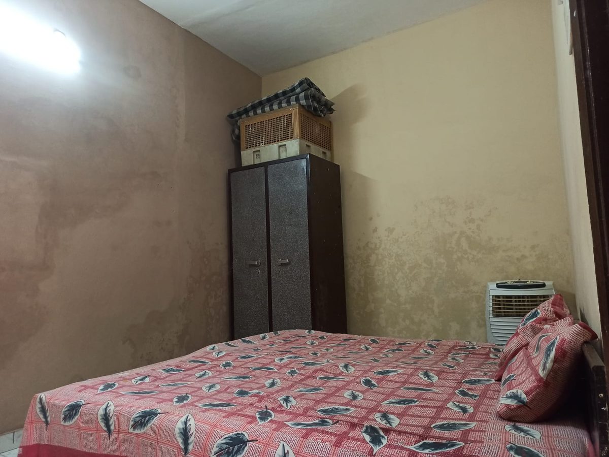 Double bed, almirah and air cooler