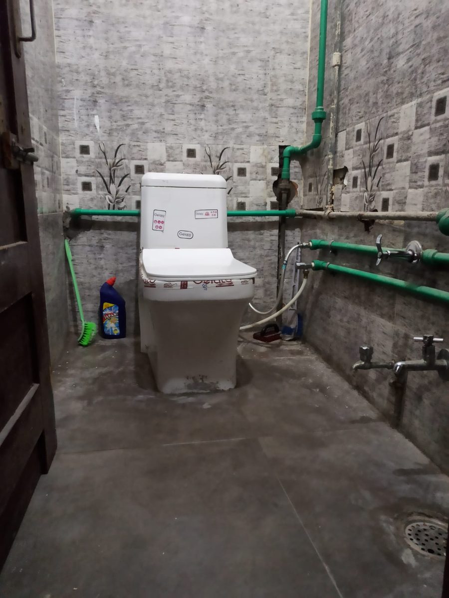 Western toilet — tiled and well maintained